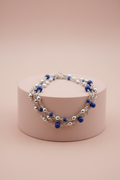 Bracciale Lamù multifilo blu royal poche sfere su piedistallo rosa cipria