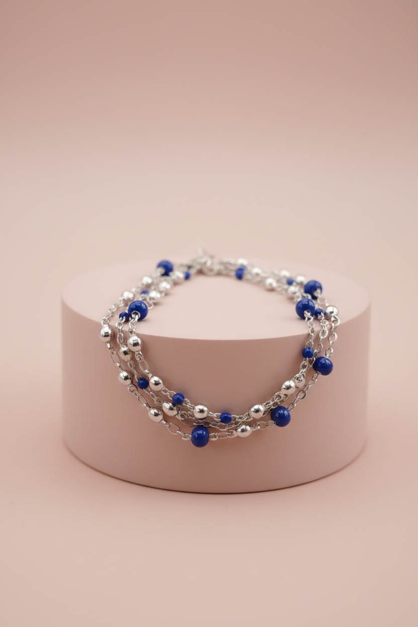 Bracciale Lamù multifilo blu royal poche sfere su piedistallo rosa cipria