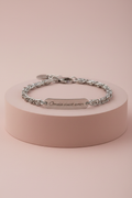 Lamù bracciale uomo acciaio catena bizantina targhetta Omnia vincit amor su piedistallo rosa cipria