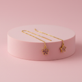 Orecchini saliscendi fiore strass rosa su piedistallo rosa cipria