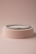 Lamù bracciale rigido apribile piccole sfere acciaio inox su piedistallo rosa cipria
