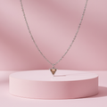 Collana triangolo zircone topazio su piedistallo rosa cipria