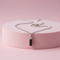 Collana zircone nero su piedistallo rosa cipria