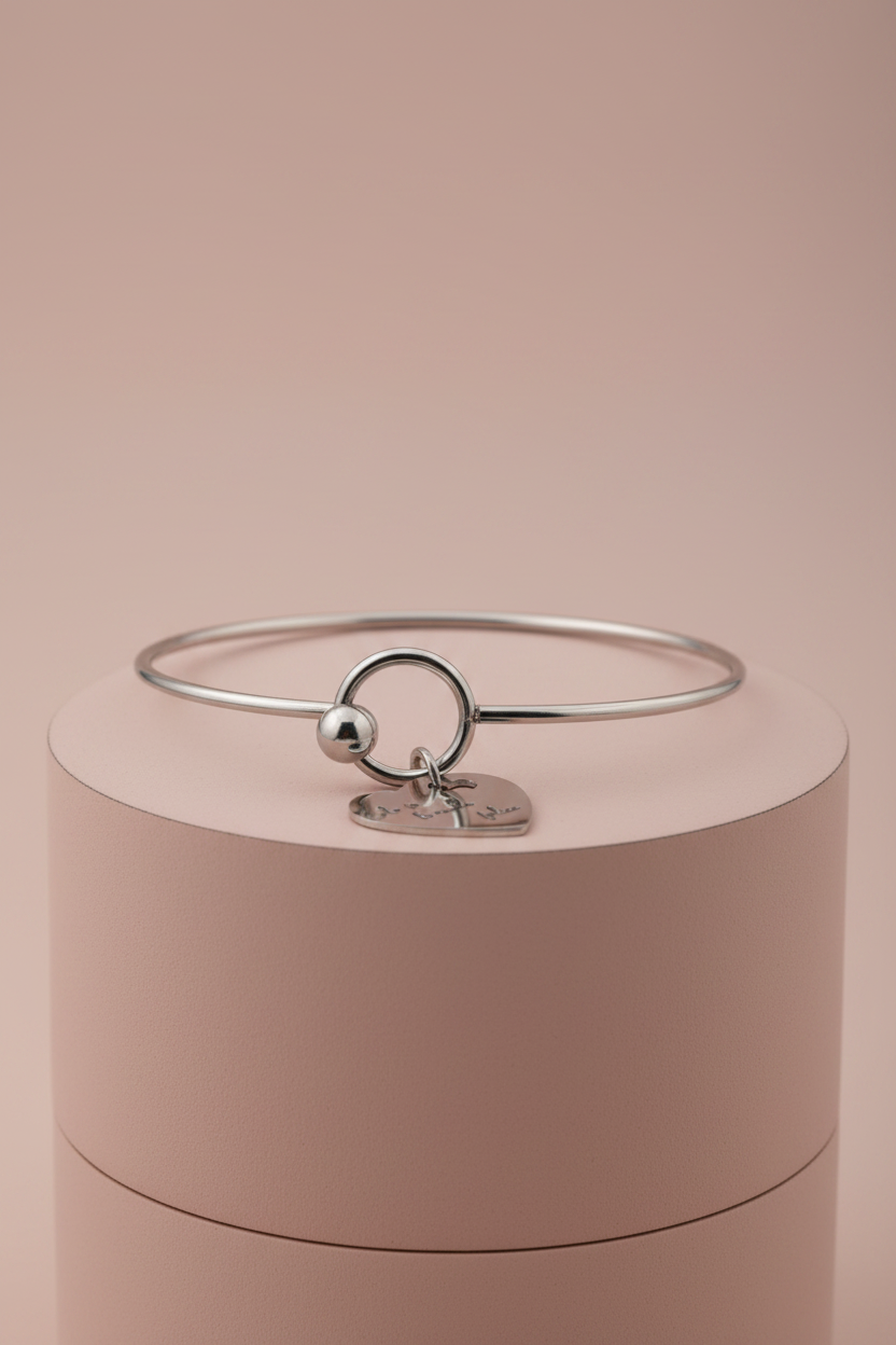 Lamù bracciale rigido acciaio cuore inciso Solo se ti rende felice su piedistallo rosa cipria