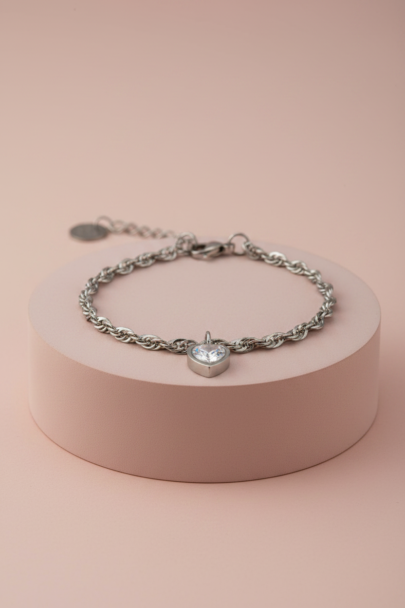 Lamù bracciale acciaio rolo con charm cuore zircone su piedistallo rosa cipria