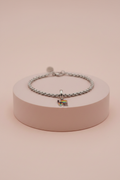 Lamù bracciale acciaio charm LOVE arcobaleno su piedistallo rosa cipria