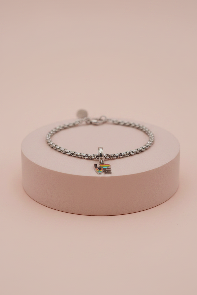 Lamù bracciale acciaio charm LOVE arcobaleno su piedistallo rosa cipria